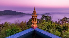 Time lapse of sunrise with fog at Wat Phra That Doi Phra Chan temple on the top hill of Doi Phra Chan mountain in Mae Tha district, Lampang province, Thailand.