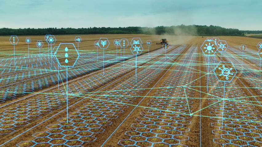 Aerial Shot: Harvester Working on Field. Digitalization of the Crops Growing Efficiency with AI Data Analysis Icons. Futuristic Agriculture Concept of Computerized, Eco, Sustainable way of Harvesting | Shutterstock HD Video #1064716777