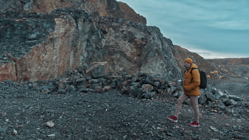 Photographer photographing mountain landscape in 4k UHD