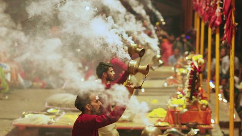 
Varanasi, India - February 15, 2019: Hindu priests perform the traditional Ganga Aarti ceremony on the banks of the Ganges River in the holy city of Varanasi, Uttar Pradesh, India.