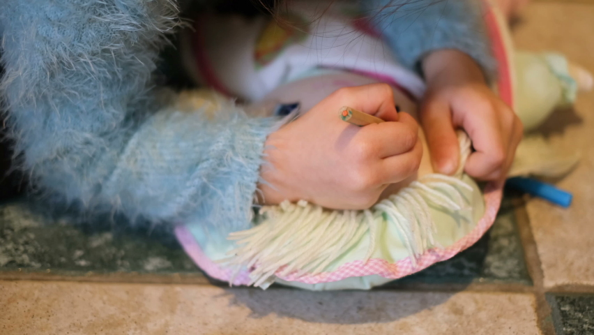 Little child daughter play with doll make up at home,childhood family lifestyle