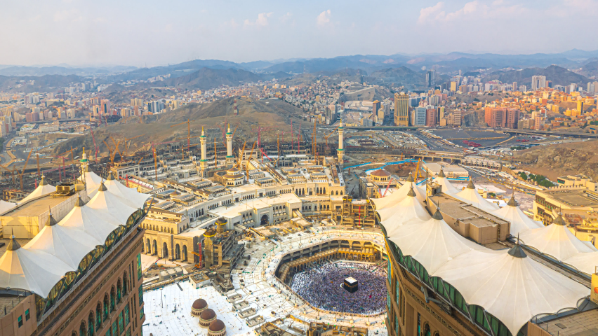 Time lapse wide angle of Muslim pilgrims circling around the holy Kaaba at day and praying inside al Masjid al Haram in Mecca, Saudi Arabia. Prores 4K | Shutterstock HD Video #1064763163