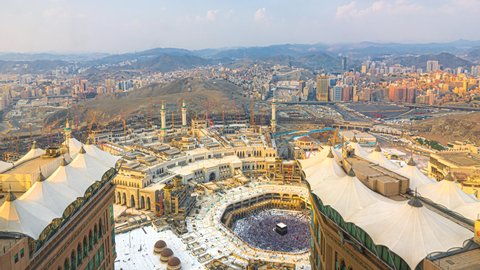 Time lapse wide angle of Muslim pilgrims circling around the holy Kaaba at day and praying inside al Masjid al Haram in Mecca, Saudi Arabia. Prores 4K
