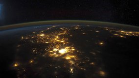 ISS Time-lapse Video of Earth seen from the International Space Station with dark sky and city lights at night over Mexico to Florida, Time Lapse Full HD. Images courtesy of NASA. Pan up motion.
