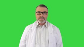 Doctor talk concept Mature male therapist share information provide support on a Green Screen, Chroma Key.