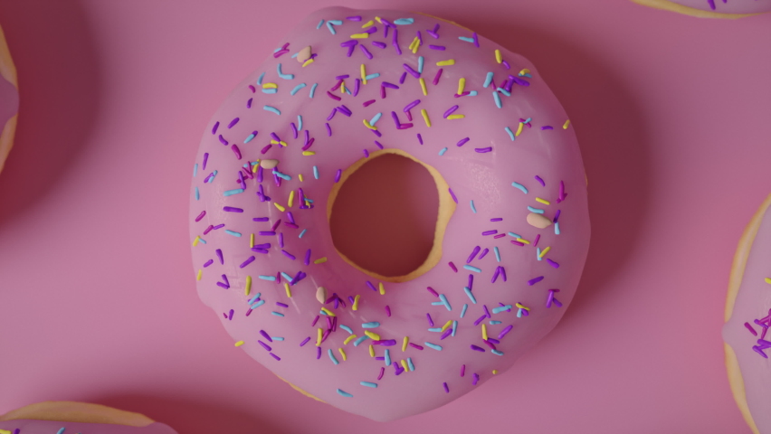 Pink frosting donuts on a pink background  Royalty-Free Stock Footage #1064776423