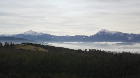 Panoramic view on the snowy mountain ridge