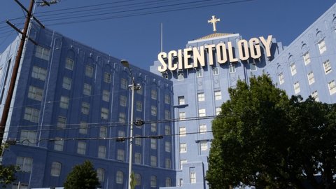 Los Angeles, California USA - 24 Feb 2020: Church of Scientology exterior, facade of blue building near American Saint Hill Organization in Hollywood. Logo and cross. International religious movement.