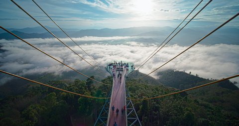 Timelapse of tourist come to see beautiful sunrise and Sea of Mist fog at Skywalk at Ai Yerweng scenic viewpoint tower, Betong, Yala, Thailand, December 2020