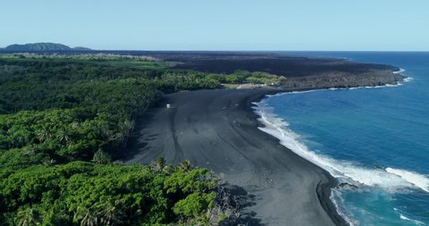4k panning left to right aerial footage of the Pohoiki Black Sand Beach or Isaac Hale Beach park from point of view out into the water,Big Island,Hawaii,usa