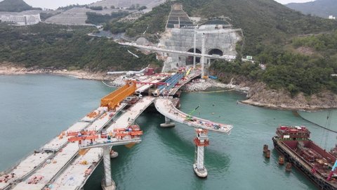 Large-scale sea traffic viaduct bridge at sea under construction works in Lohas Park,Tseung Kwan O of Hong Kong city, Kowloon Aerial Top view