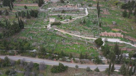 Drone video of iconic Temple of Athena Pronaia in archaeological site of Delphi, Voiotia, Greece