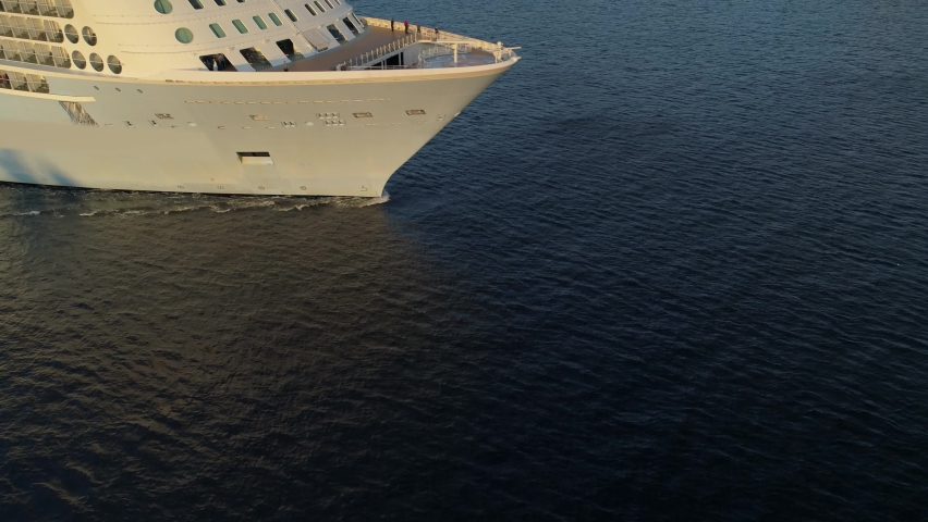 Aerial forward luxury cruise ship large modern tourist liner, high seas of ocean. Close-up ship