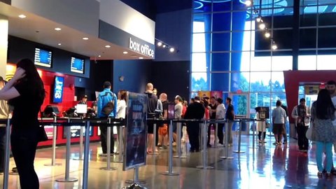 Coquitlam, BC, Canada - June 26, 2015 : People line up for buying movie ticket at cinema