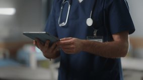 Hospital Ward: Unrecognizable Head Nurse, Doctor, Surgeon Uses Digital Tablet Computer Health Care Vitals Monitoring Computer Machine. Modern Clinic with Advanced Equipment and Professional Working - Powered by Shutterstock - Get 15% off with code: PIKWIZARD15