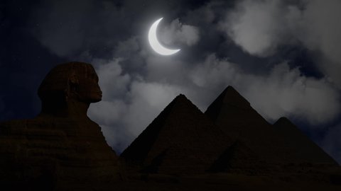 Sphinx and Pyramids of Giza By Night with Crescent Moon and Clouds, Cairo, Egypt