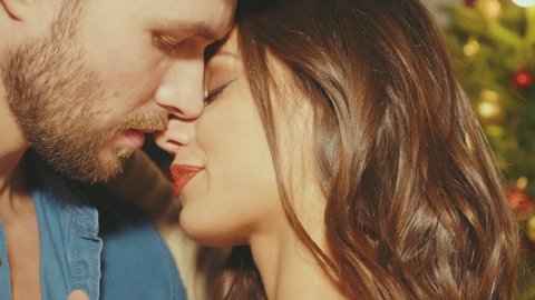Hot beautiful woman and her handsome boyfriend. Models posing indoors. Young passionate couple hugging before having sex. Sensual pair getting closer for kiss. Lover couple. Closeup lips view