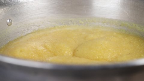 Cooking yellow polenta -porridge- detail
