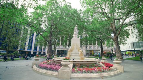 London, UK - December 2, 2020: Statue of William Shakespeare - a fountain in the center of Leicester Square. Its a city icon, cultural hub and entertainment epicentre in central London, England, UK.