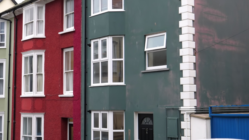 Slow panning showing colorful houses of Welsh seaside town Aberystwyth.