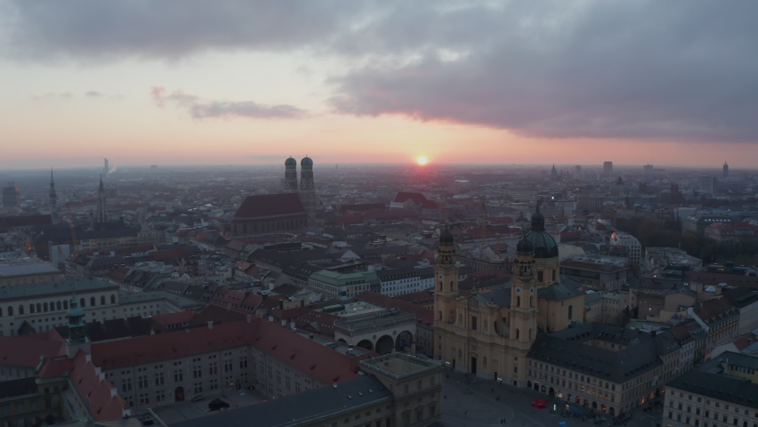 Circling Munich City Center, Aerial Perspective of Bavarian City in times of Coronavirus Covid 19 Pandemic Lockdown, No People in Public Park and less car traffic in big cities | Shutterstock HD Video #1064847571