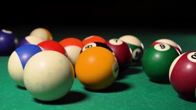 American billiards Ball on black background. Green Pool table with balls closeup 4k video