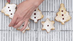 Christmas shortbread cookies with raspberry preserves. Close up accelerated video, step by step recipe from raw ingredients to delicious homemade dessert