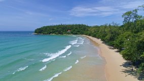 Aerial video Drone camera shot of Beautiful sandy beach with wave crashing on sandy shore at Phuket Islands Beautiful tropical sea Karon beach Thailand,Beautiful tropical island with white sand beach