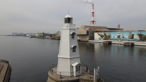 Ohamakitamachi, Osaka, Japan- Circa 2020: 4K Aerial Drone POI (Point of Interest) Footage of Old Sakai Lighthouse (the Oldest Remaining Wooden Lighthouse in Japan, Nationally Designated Historic Site)