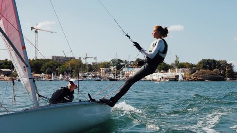 SEVASTOPOL, CRIMEA - SEPTEMBER 28, 2020: female sailor is training on sport sailing yacht 