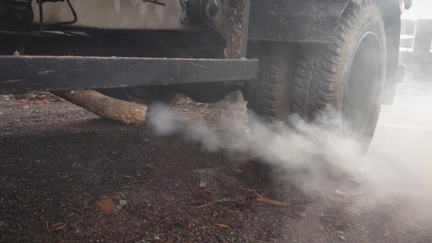 Exhaust fumes coming out of old truck. Car pollution, air pollution concept video.