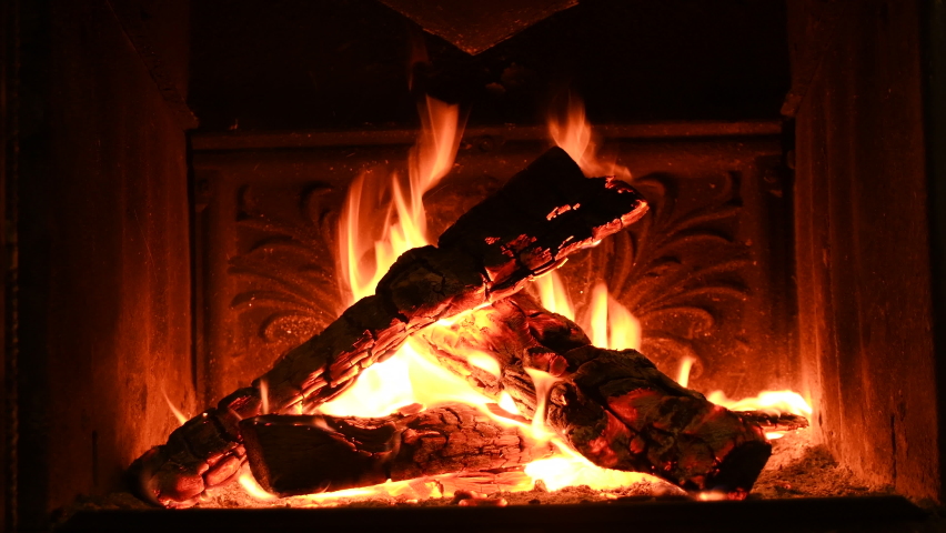 Warm cozy burning fire in a brick fireplace, close-up shot 4k. | Shutterstock HD Video #1064872624