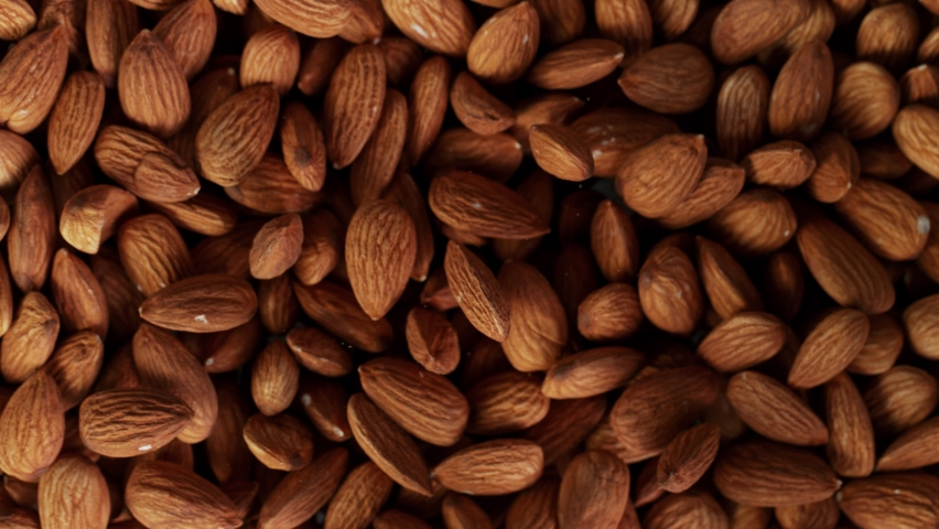 Super Slow Motion Shot of Almonds Background at 1000 fps. Royalty-Free Stock Footage #1064879422