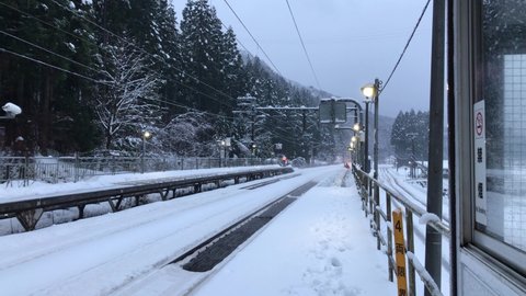 Fukui, Japan-January02,2021;Japanese express train Thunderbirds  passing from station in a snowy day