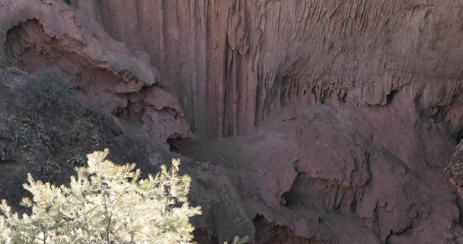 Geologic formation of the walls at the Tonto Natural Bridge in Arizona, US.  It was formed by a flow of lava in the form of Rhyolite, a red, coarse-grained volcanic rock. 