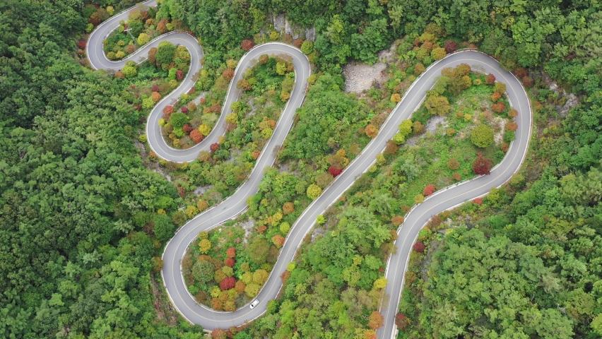 Curved road taken with a drone | Shutterstock HD Video #1064908522