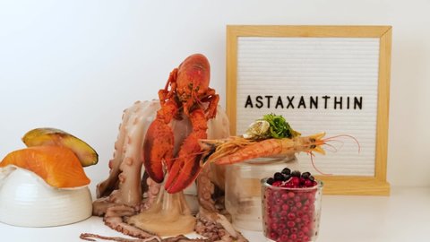 Astaxanthin Healthy Nutrition food, rich in iodine, omega3, antioxidants on white background, copy space