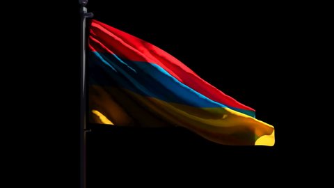 The national flag of Armenia is flying in the wind against a black background