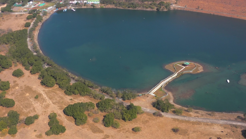 Aerial footage of High Island Reservoir, Pavilion in the middle of water, National Geo Park in Hong Kong