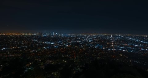 Los Angeles skyline timelapse at night. Big american city. Skyscrapers and street lights with traffic