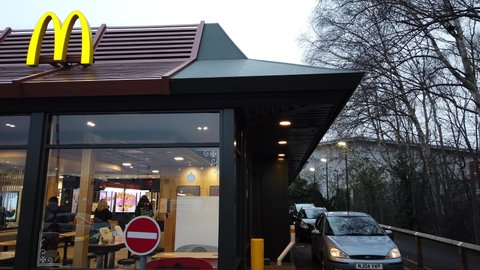 READING, UK - JANUARY 2, 2021: Cars use the drive thru at a McDonald's restaurant in Reading, Berkshire, UK.
