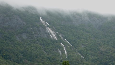 Beautiful waterfall cascades from the summit during the monsoon season at the south Ranong of Thailand.