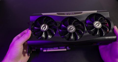 Budapest, Hungary - Circa 2020: Nvidia Geforce RTX 3090 Graphics Card made by EVGA inspected in hand. Model: EVGA Geforce RTX 3090 FTW3 ULTRA. Ampere architecture GPU
