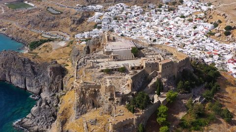 Ruins of Acropolis of Lindos view from above, Rhodes, Dodecanese Islands, Greek Islands, Greece. Acropolis of Lindos, ancient architecture of Rhodes, Greece. 
