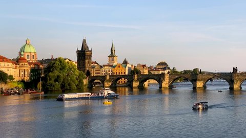 Charles Bridge in Prague in Czechia, Prague, Czech Republic. Charles Bridge (Karluv Most) and Old Town Tower. Vltava River and Charles Bridge, concept of world travel, sightseeing and tourism.