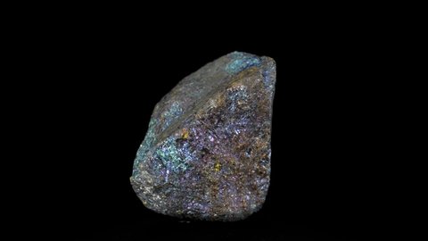 Natural stone, multicolored blue-green chalcopyrite, rotation on a black background. Minerals, natural stones, close-up.