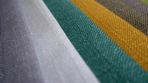 Colorful fashion fabric samples. Textile textures swatches concept. Woven fabric is any textile formed by weaving. Different colors. Clothes texture closeup