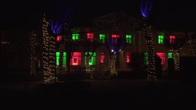 Sample of the building facade and urban environment illumination. Decorative and spooky festive lights at night. The landscape design of city architecture in the festive time of Christmas and New Year - Powered by Shutterstock - Get 15% off with code: PIKWIZARD15