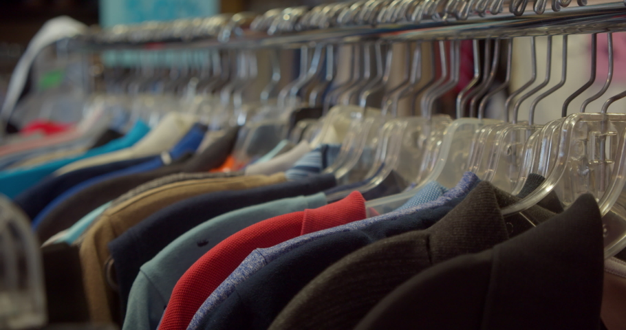 Closeup of Clothing in Thrift Shop Royalty-Free Stock Footage #1064987734