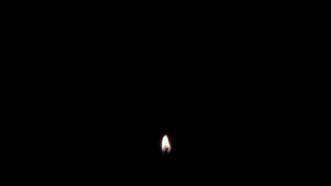A flickering isolated candle fire